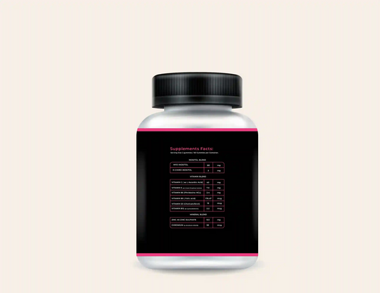 Bottle of PCOS Support Gummies with a black and pink label showing supplement facts, including inositol, vitamins, and minerals.