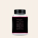 Bottle of PCOS Support Gummies with a black and pink label showing supplement facts, including inositol, vitamins, and minerals.