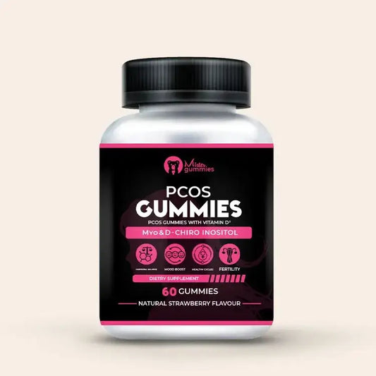A white bottle of "Mister Gummies" PCOS Gummies sits on a light pink surface. The black label has pink accents and lists the product as a "Dietary Supplement" with Myo & D-Chiro Inositol. Icons below the text highlight its benefits for hormonal balance, mood boost, healthy cycles, and fertility. The bottle contains 60 gummies and is a natural strawberry flavor.